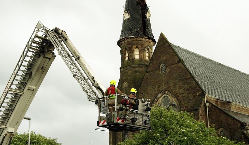 John Stevenson, Courier,27/05/10.Dundee.Broughty Ferry,Lightening Strike on steeple at St Stephen's and West Parish Church.Pic shows firefighters as they survey the damage to the steeple.