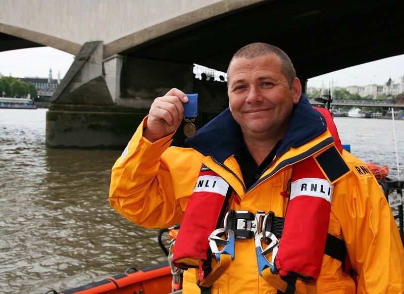 Dunbar RNLI lifeboat coxswain Gary Fairbairn pictured at Tower lifeboat station in London today (Wednesday 26th May 2010) holding the RNLI Bronze Medal for Gallantry which he wil be presented with by HRH Prince Michael of Kent at a ceremony held at the Barbican tomorrow 27th May 2010. Gary was awarded the medal for his part in the rescue of two people from the stricken yacht Ouhm in severe gale force 9 conditions and 10m seas on the night of 15th May 2009.