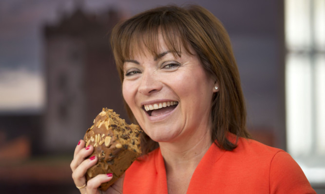 Famous city citizen 
Lorraine Kelly with a piece of Dundee cake.