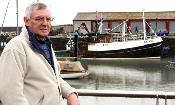 John Swankie, with the Crystal Tide in the background.