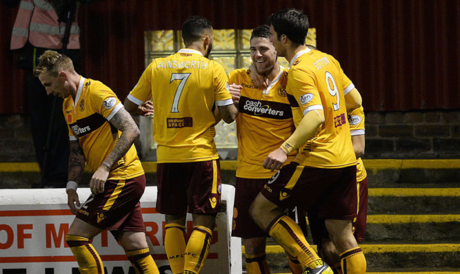 Iain Vigurs (second right) is mobbed by his Motherwell team-mates as they celebrate his opener