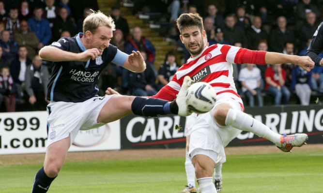 Dundees Gary Irvine, in a challenge with Hamiltons Jesus Garcia Tena, is enjoying his stint as Dark Blues captain.