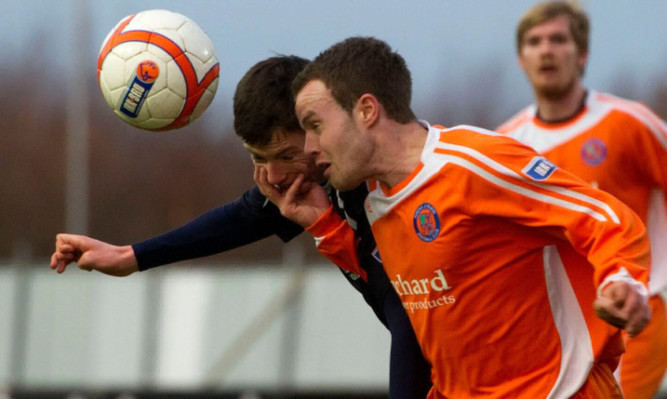 Forfar's Gavin tussles with Johnny Flynn.