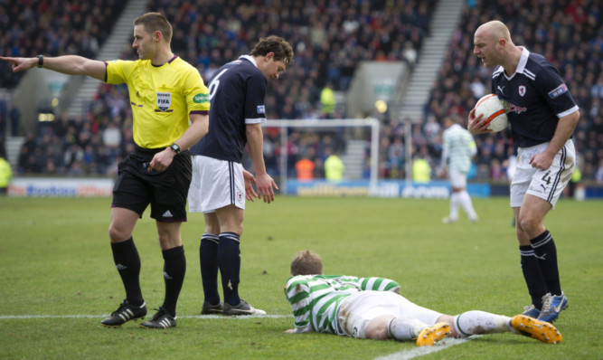 Steven McLean points to the penalty spot after ruling Raith Rovers' Simon Mensing fouled Kris Commons.