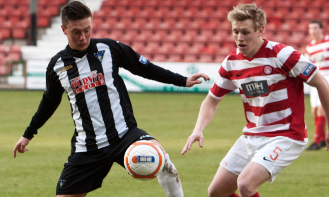 Dunfermline's Joe Cardle (left) holds off Jonathan Page.