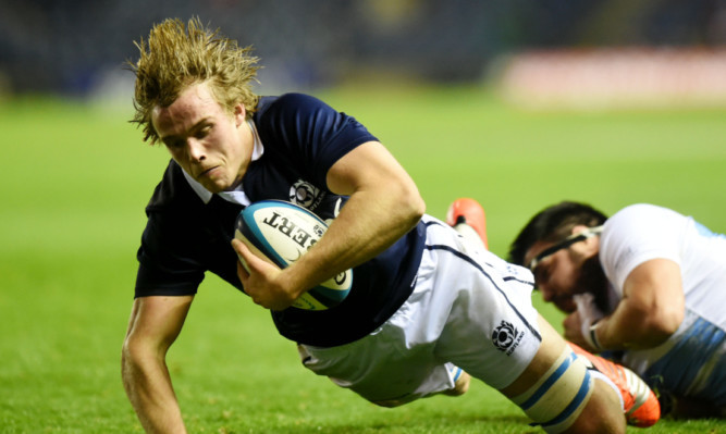 Jonny Gray scores a try against Argentina.