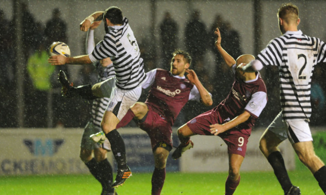 Arbroath apply some pressure in the goalmouth.