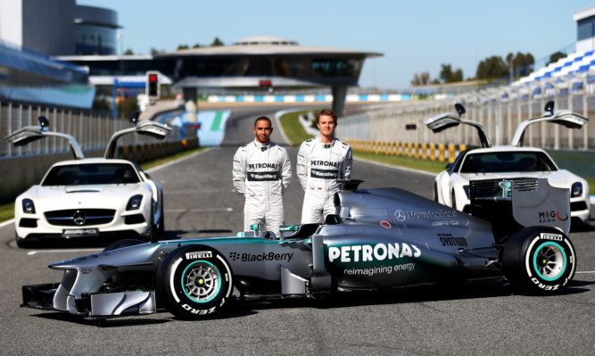 Lewis Hamilton and Nico Rosberg with this season's Mercedes car.