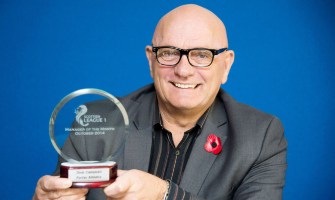 Dick Campbell with his award.