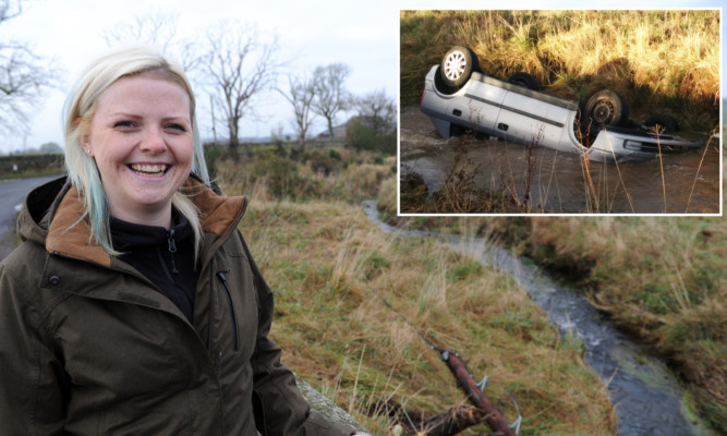 Krystyna back at the scene of her ordeal. Inset: her car almost completely submerged after last week's accident.