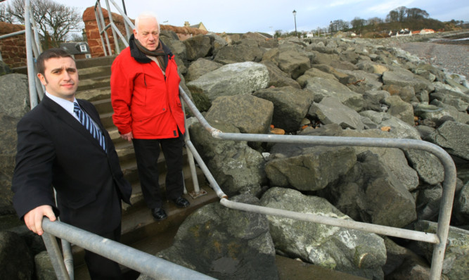 Councillors David Graham and Jim Young at the sea defences in East Wemyss.