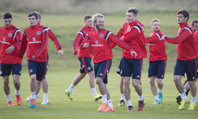 Johnny Russell is put through his paces at training with the rest of his team-mates