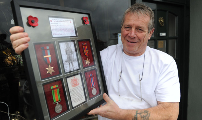 Mr Adam with Pte Millars medals.