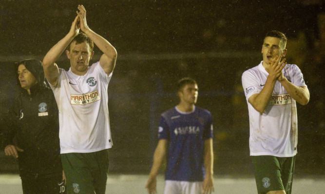 Hibs' Liam Craig (left) and Paul Hanlon applaud their fans at full-time after their victory against Cowdenbeath.