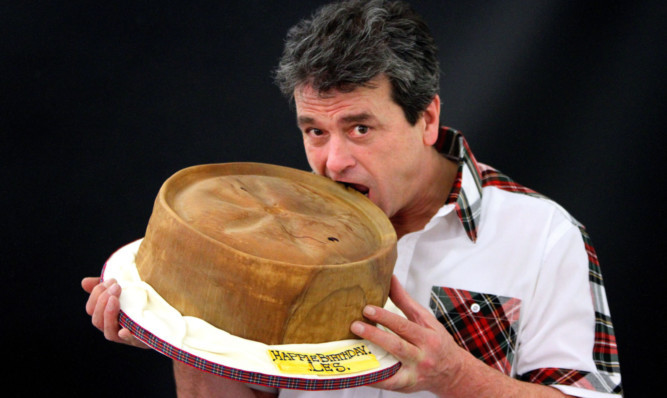 Bay City Rollers singer Les McKeown with his pie-shaped birthday cake in Dunfermline.