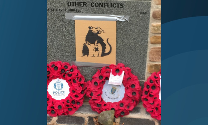 A 'Banksy-style' image of a rat was added to the memorial.