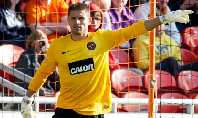 Radoslaw Cierzniak in action for Dundee United.