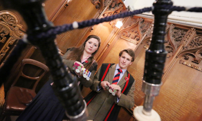 Glenalmond captains of college Hannah-Jane Headon and Angus Sandison with the medals.