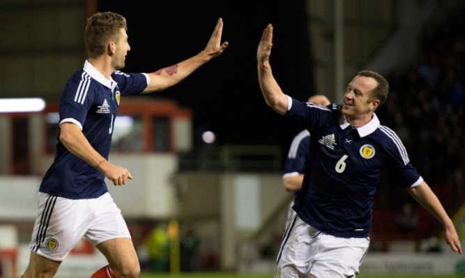 Scotland's Charlie Mulgrew (left) celebrates his goal with Charlie Adam.