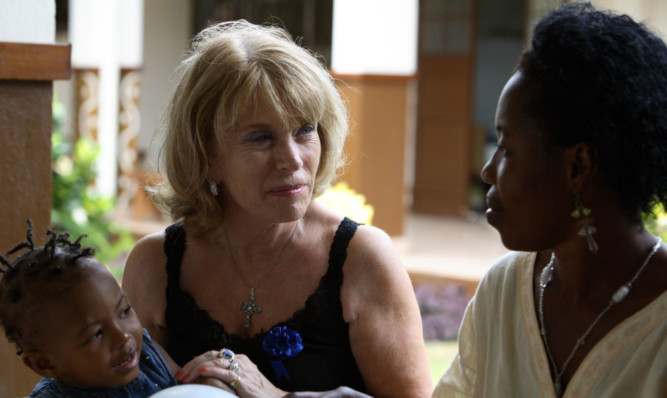 Ann Gloag with Faith and Kumba Koromo in Sierra Leone.