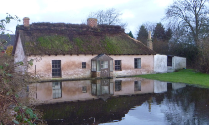 The National Trust for Scotland rejects claims that not enough is being done to preserve the Old Schoolhouse in Cottown.