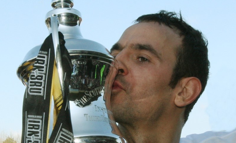 Football, East Fife v Arbroath.   East Fife win the Third Division.   Two goal hero Paul McManus kisses the 3rd Division Trophy.