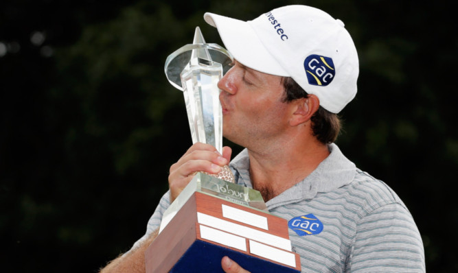 Richard Sterne kisses the Joburg Open trophy.