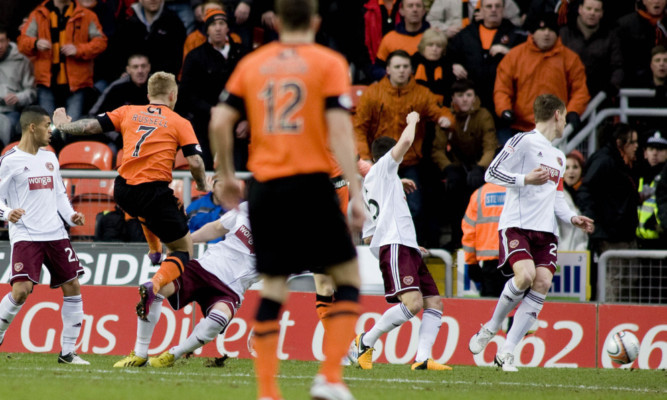 Johnny Russell (7) rifles Dundee Utd into an early lead against Hearts on Saturday.