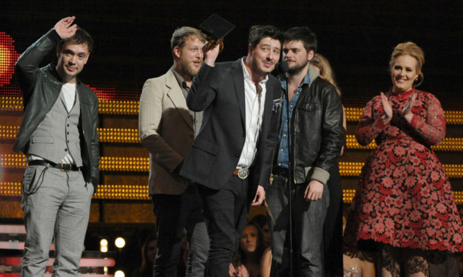 Mumford & Son accept the award for album of the year from Adele.