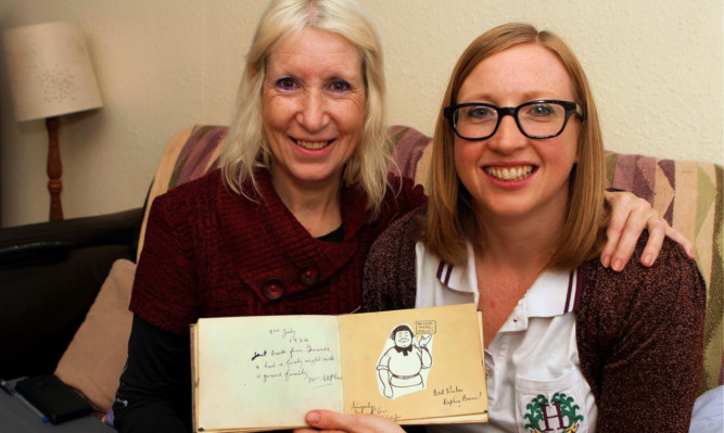 Catriona Child and mother Gillian with one of the signed books.