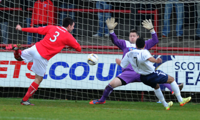 Omar Kader (right) slots home to pull Forfar back into the match just before half-time.