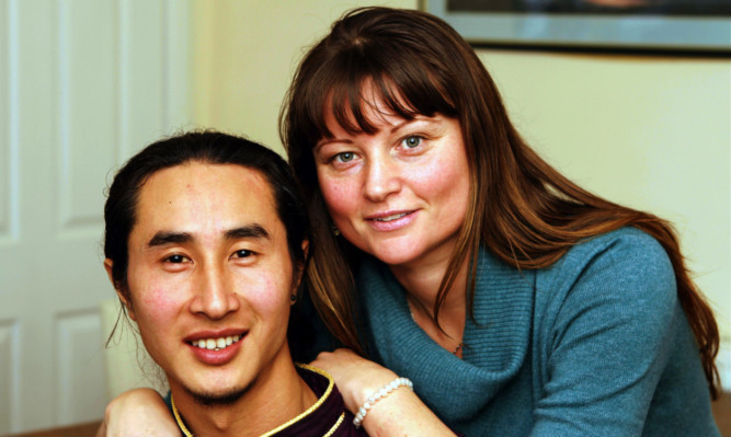 Chogonja with his wife Isla at their home in Dundee.