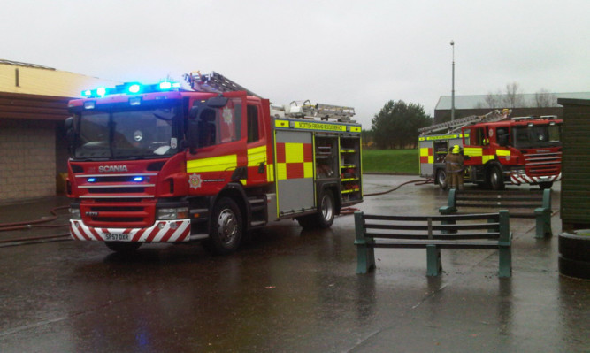 Firefighters at the school on Monday.