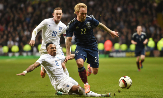 Former Dundee United star Johnny Russell made his senior debut against England.