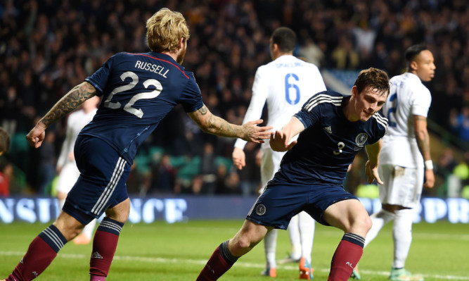 A goal made in Tannadice: Andrew Robertson wheels away after scoring Scotland's goal against England.