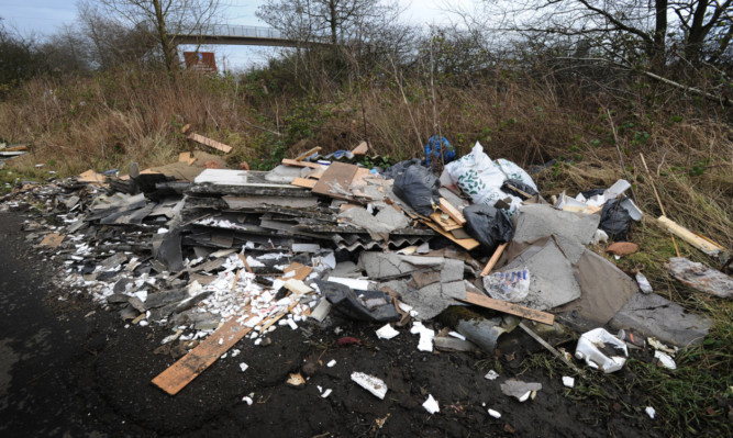 Mr Fraser says the rubbish was fly-tipped near Grantsmuir Farm in December.