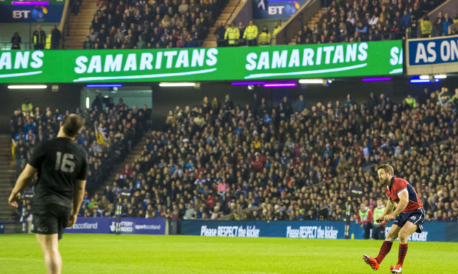 Greig Laidlaw watches a placekick backed by Scottish Rugby's most useful sponsor.