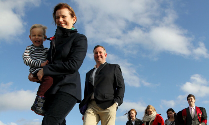 New St Andrews University rector Catherine Stihler with her husband David and sons on the traditional 'pier walk' with students to mark her taking office earlier this month.