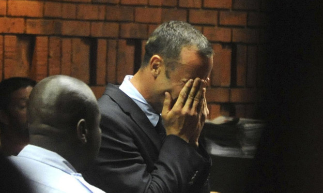Oscar Pistorius weeps in court.