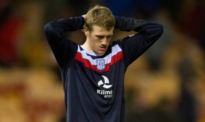 A dejected Jim McAlister at the final whistle.