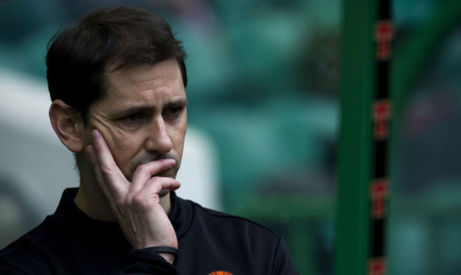 Jackie McNamara deep in thought as he watches his side struggle at Parkhead.