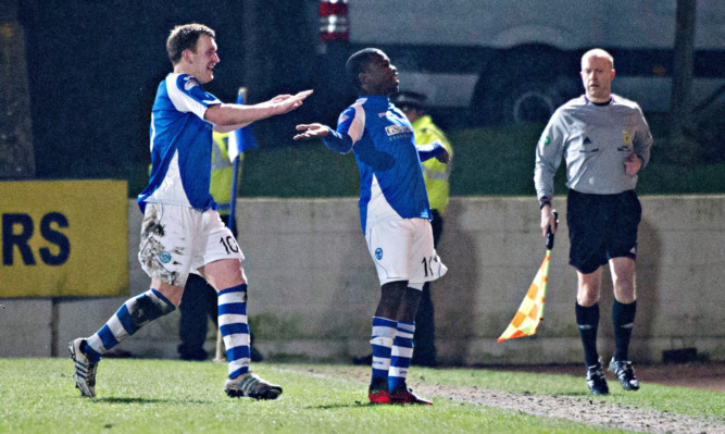 St Johnstone's Nigel Hasselbaink celebrates after scoring a late equaliser.