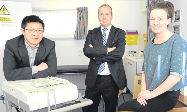 Dr Ronnie Ip, practice manager Jim Devine and receptionist Lucy Anderson.