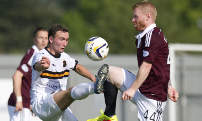 Chris Kane in action for Dumbarton against Hearts.