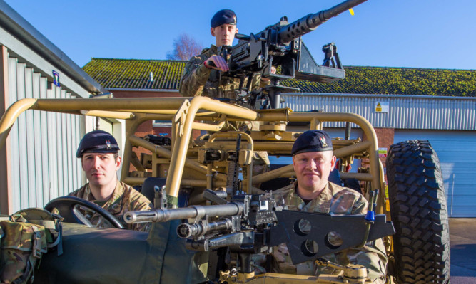 Trooper Andy Nairn on the machine gun, with Sgt Alan Gardener and Cpl Chris Donaldson.