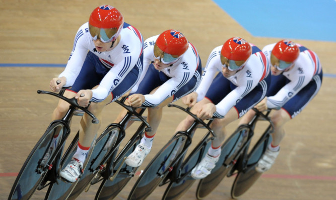 Great Britain's (left to right) Steve Burke, Ed Clancy, Andy Tennant and Sam Harrison ride to silver in the team pursuit on day one of the UCI Track Cycling World Championships.