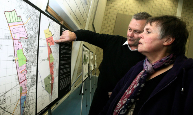 Yeoman McAllister Architects Derek Pirouet talks through the Blairgowrie plans with Hilary Johnston at Rattray Community Centre.