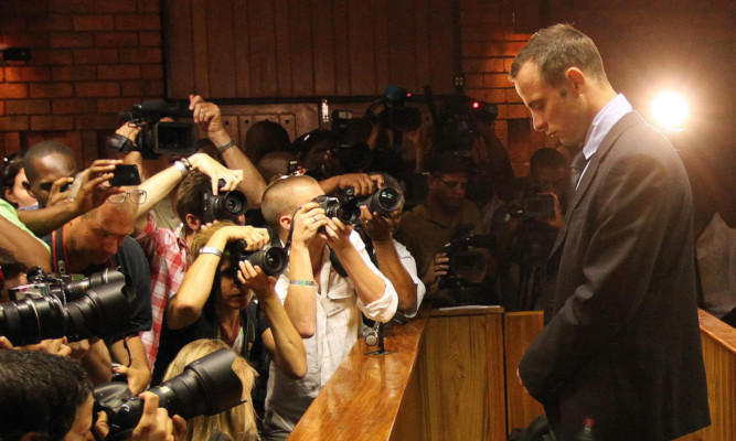 Oscar Pistorius faces the full glare of the media during Friday's bail hearing.