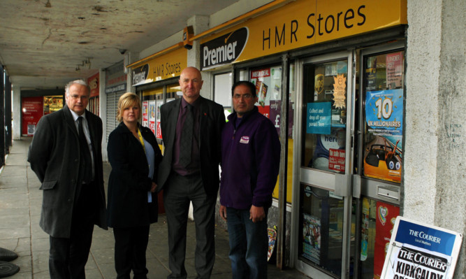 From left: council leader David Ross, councillors Carol Lindsay and Neil Crooks with Abdull Qayyum, who is one of the Birnam Road shopkeepers.