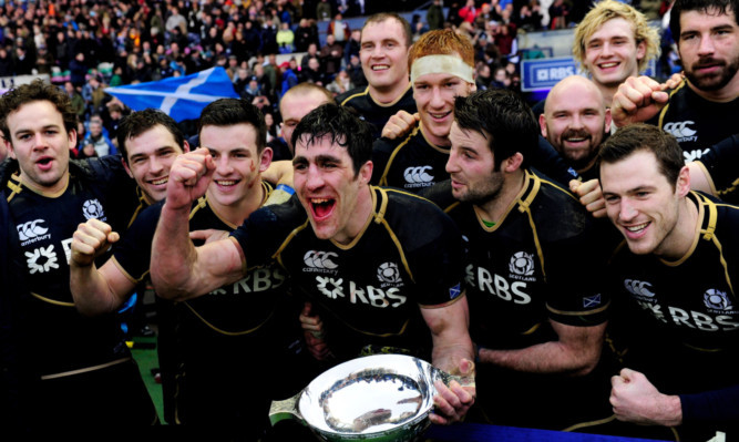 Kelly Brown and the Scotland squad celebrate at full-time.